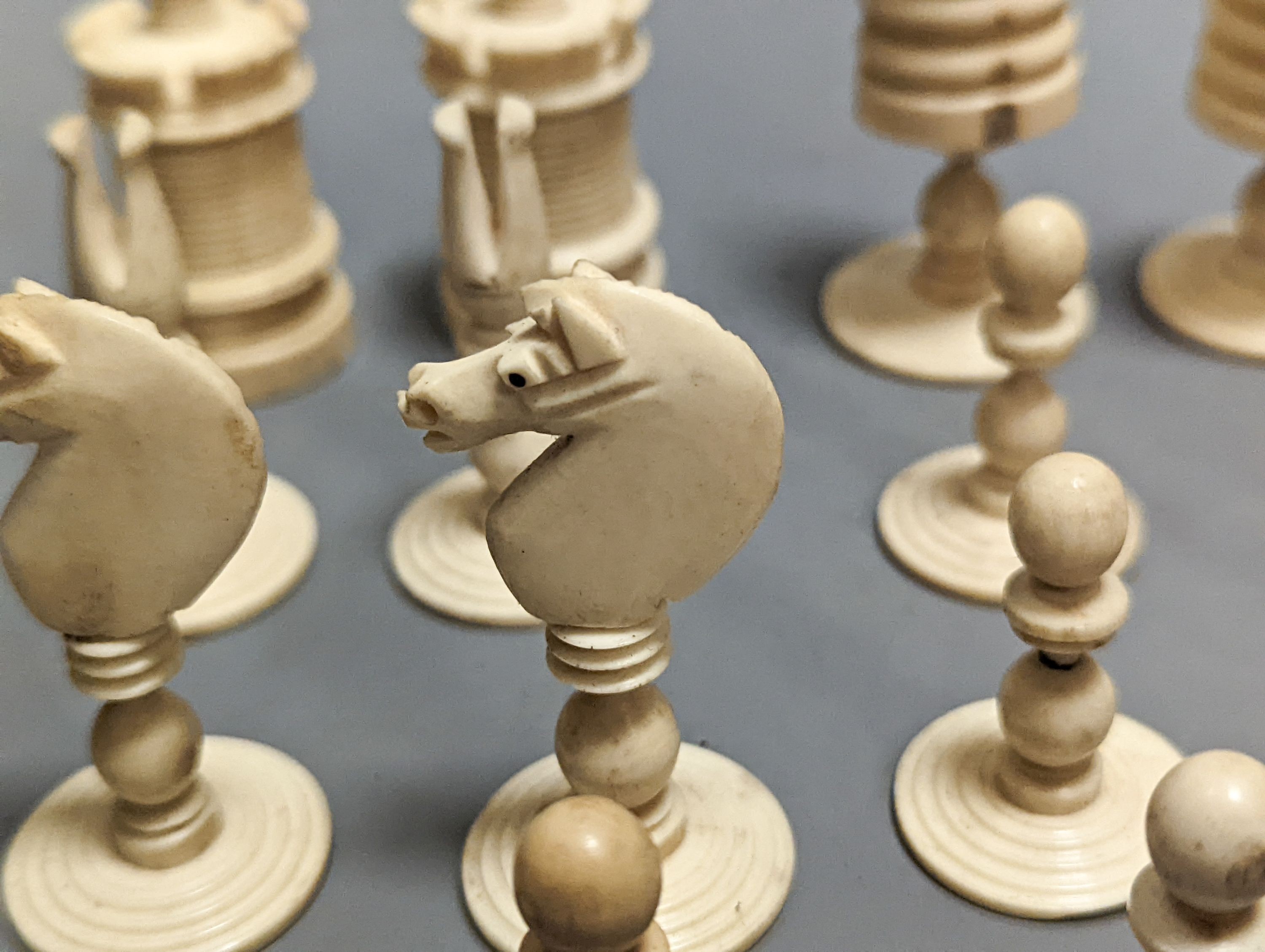 A 19th century turned ivory and bone chess set